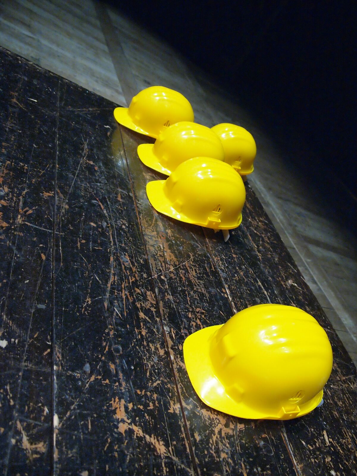 Yellow construction safety helmets on a job site