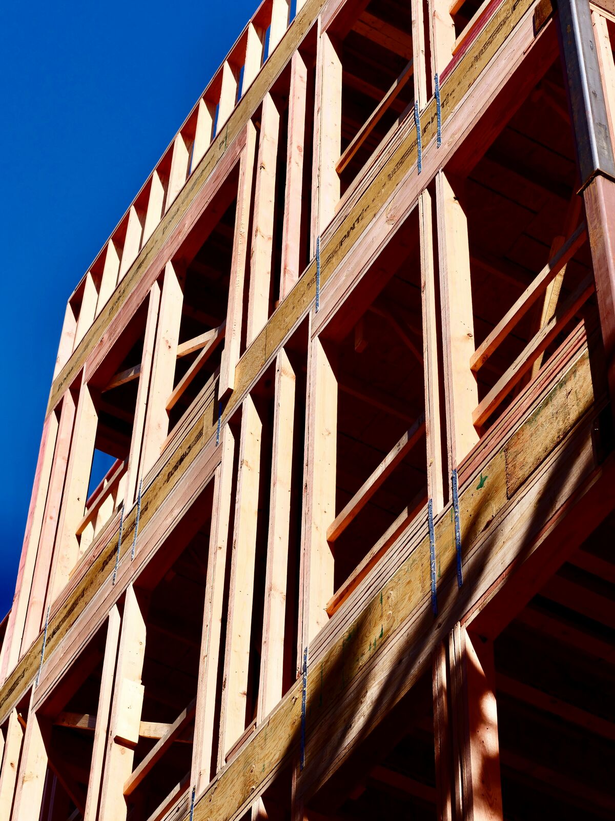 Residential building under construction showing wood framing